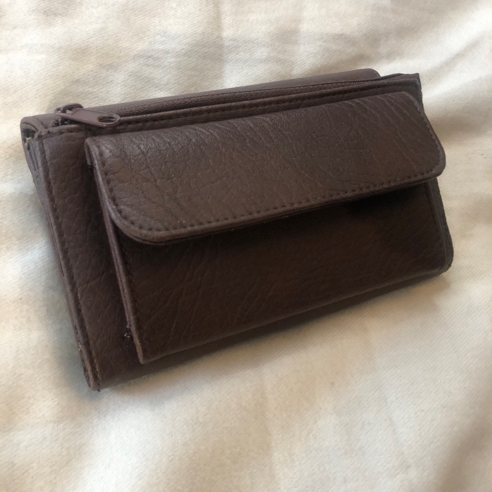 Bentley brown faux leather. Many pockets.
